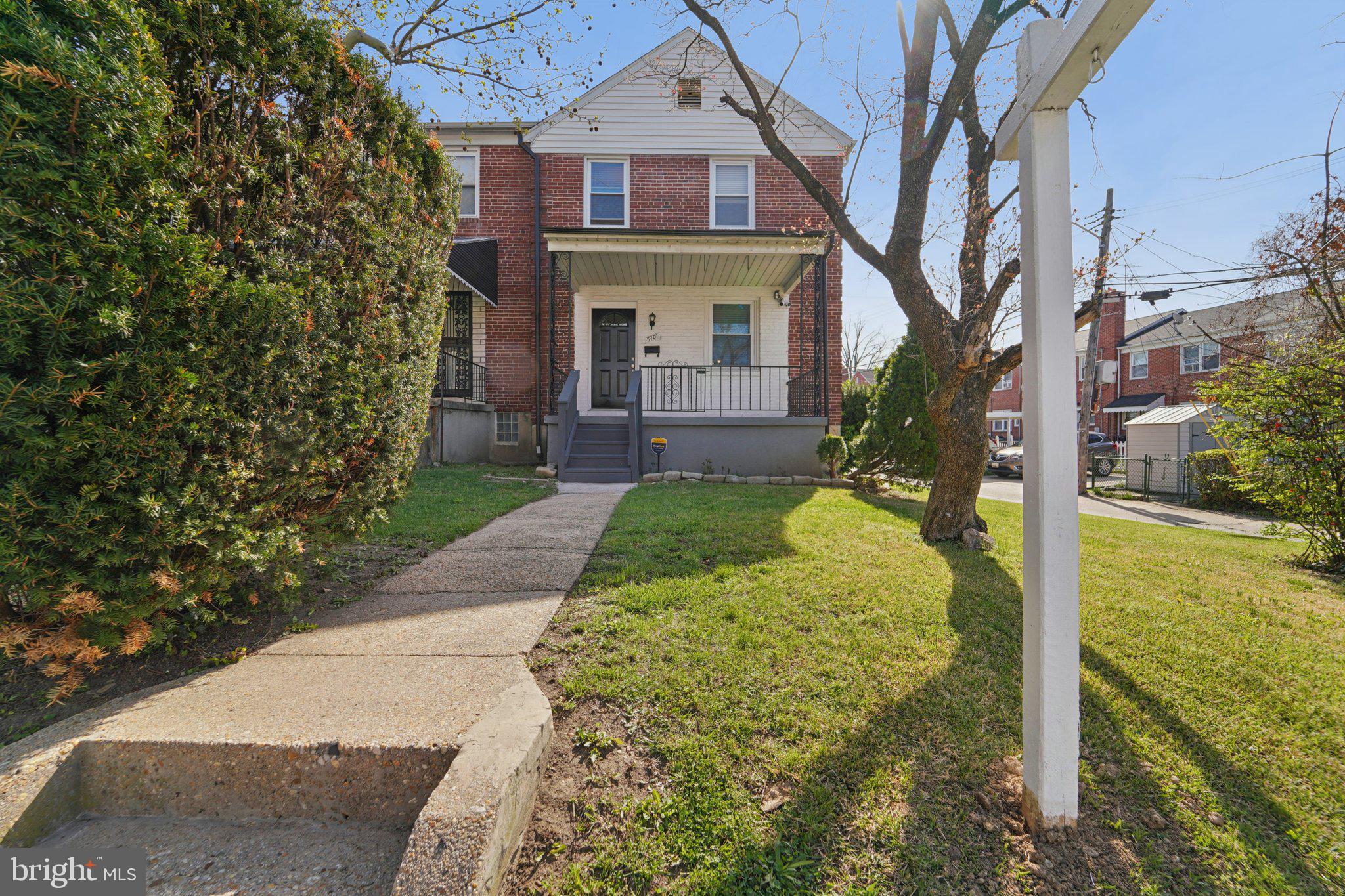 5701 The Alameda Baltimore, MD 21239 - Photo 3 of 29 a front view of a house with garden