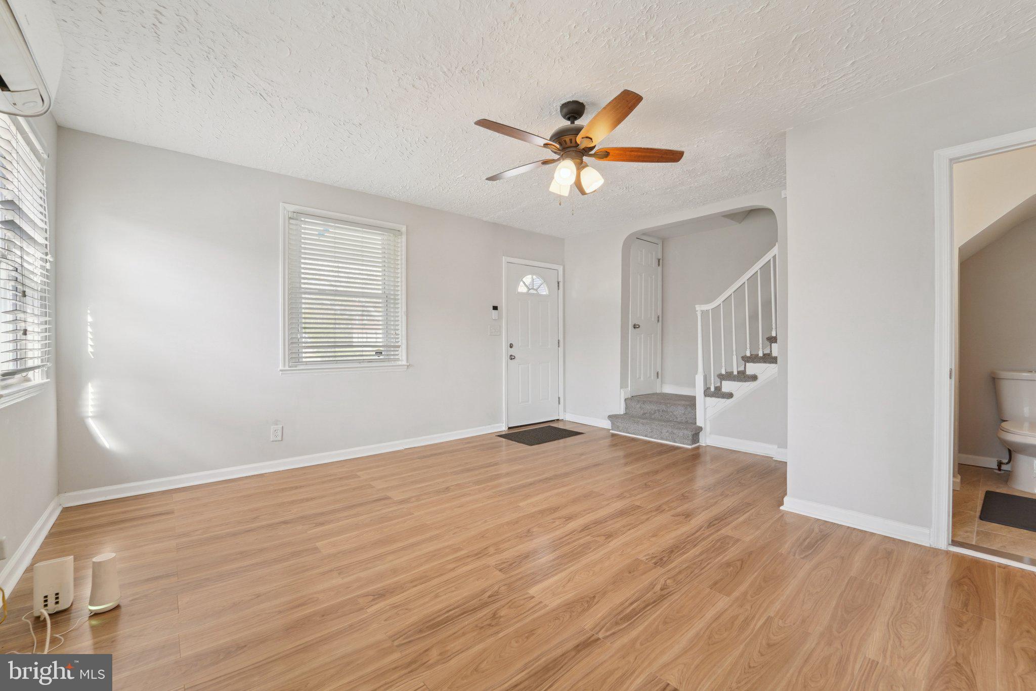 5701 The Alameda Baltimore, MD 21239 - Photo 7 of 29 a view of empty room with wooden floor and fan