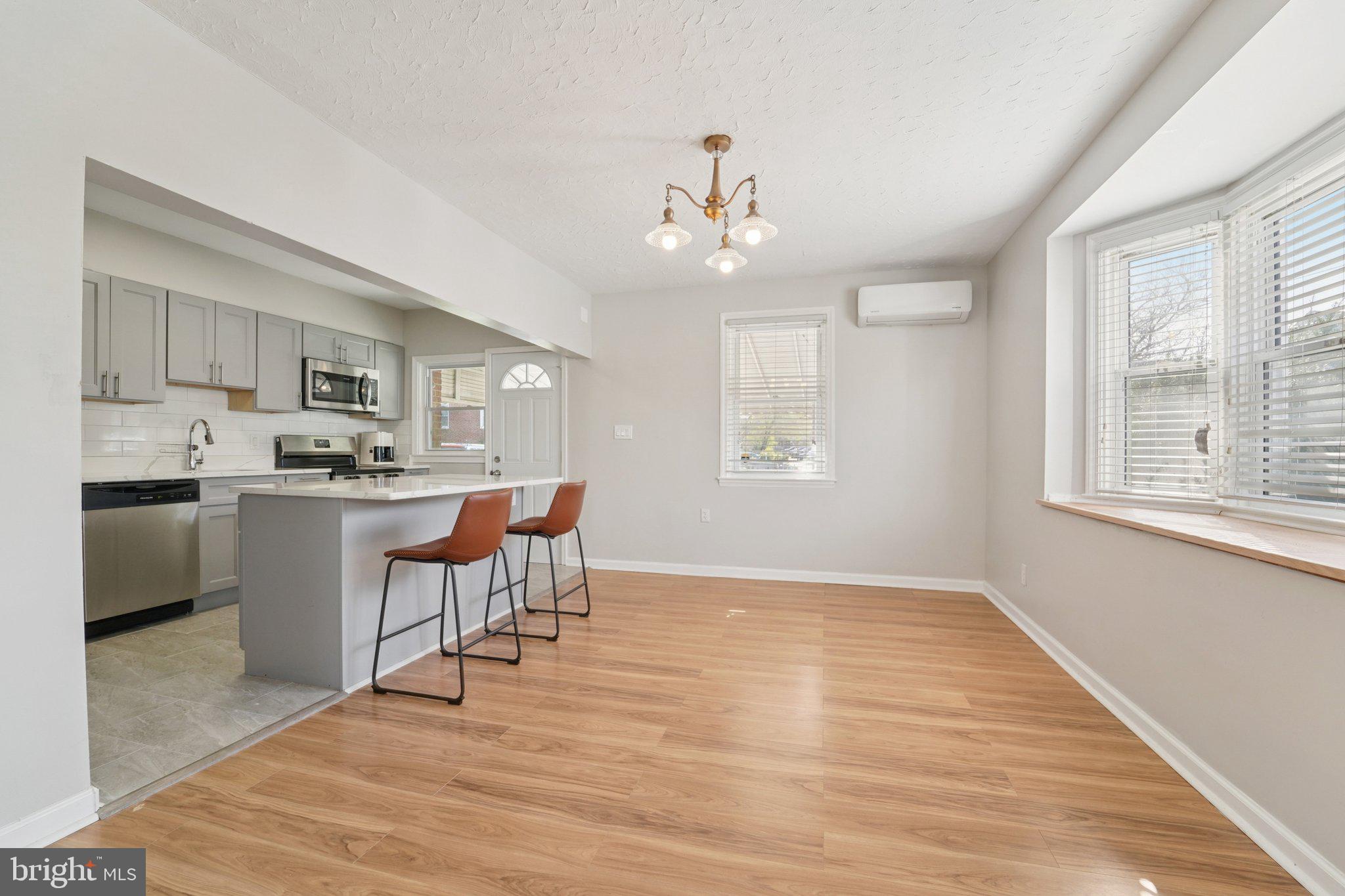 5701 The Alameda Baltimore, MD 21239 - Photo 8 of 29 a view of a dining room with furniture window and wooden floor