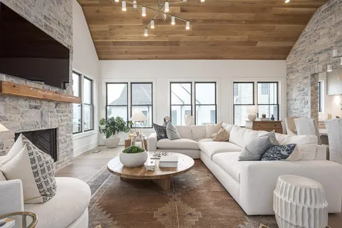 a spacious bedroom with a bed and a flat screen tv