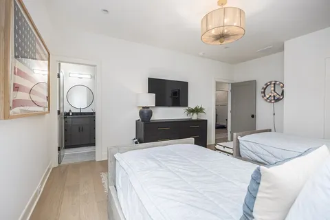 a living room with fireplace furniture and a flat screen tv