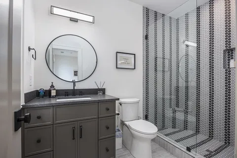 an aerial view of a house with a yard