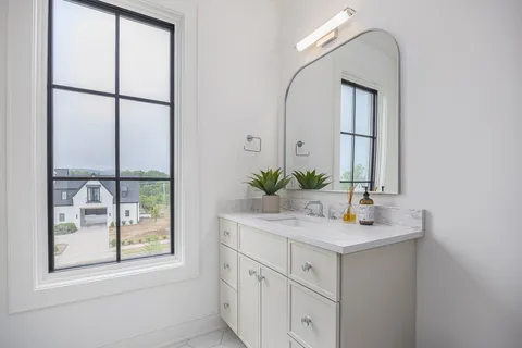 a kitchen with a sink and a large window