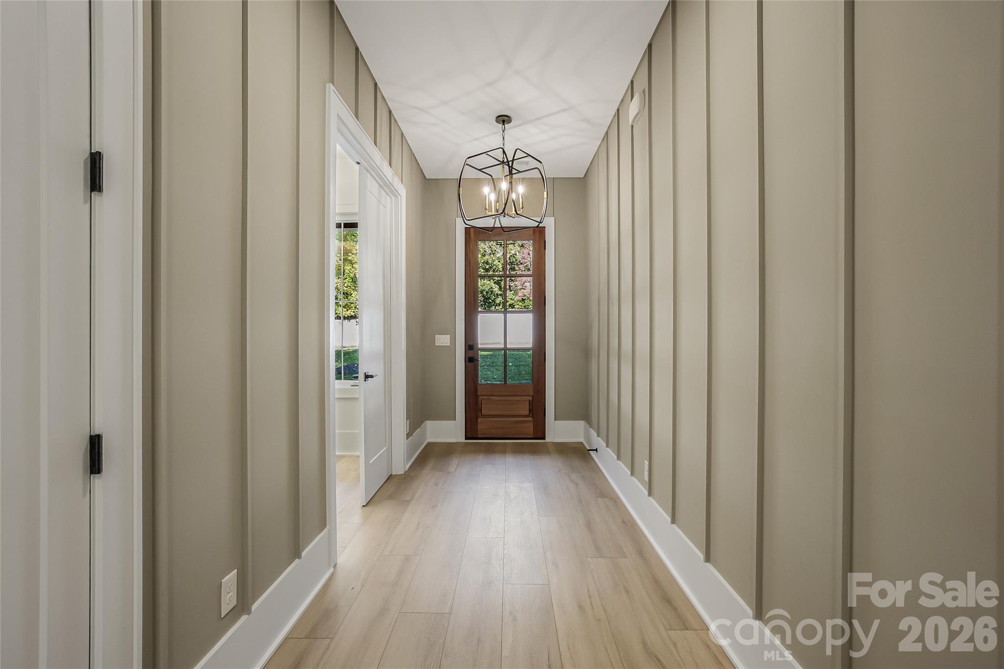 4221 Spring Street Charlotte, NC 28270 - Photo 13 of 44 a view of a hallway with wooden floor and staircase