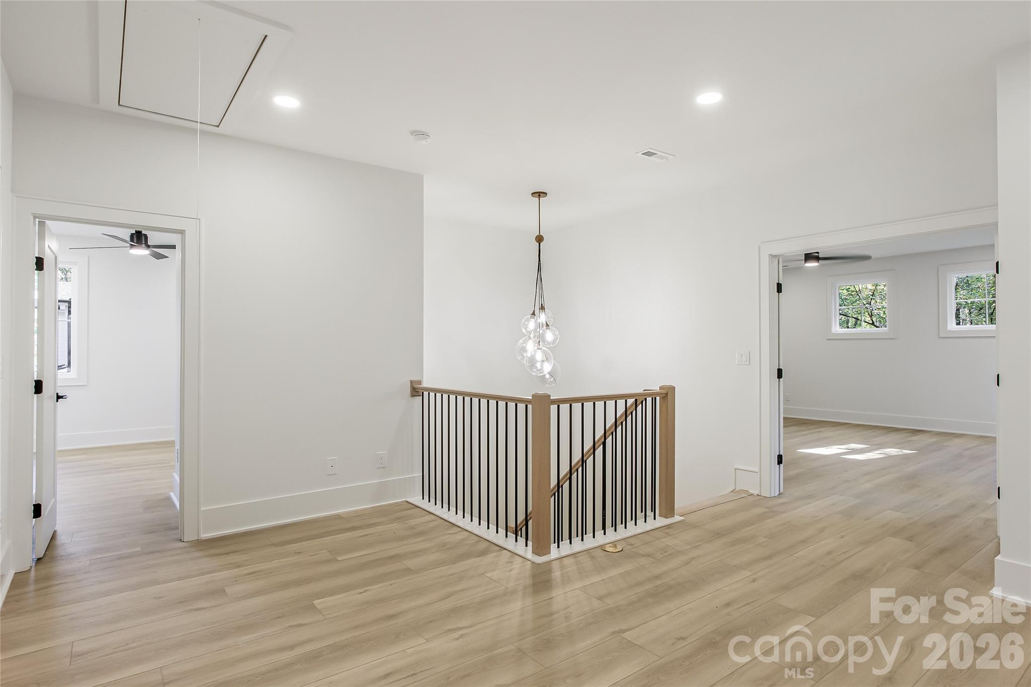 4221 Spring Street Charlotte, NC 28270 - Photo 18 of 44 an empty room with wooden floor and windows