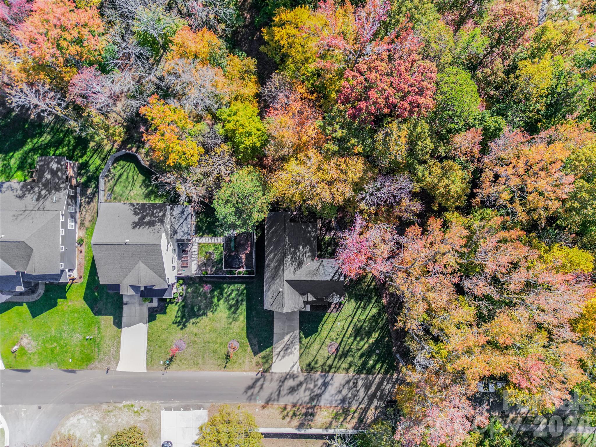 4221 Spring Street Charlotte, NC 28270 - Photo 2 of 44 a front view of a house with a tree