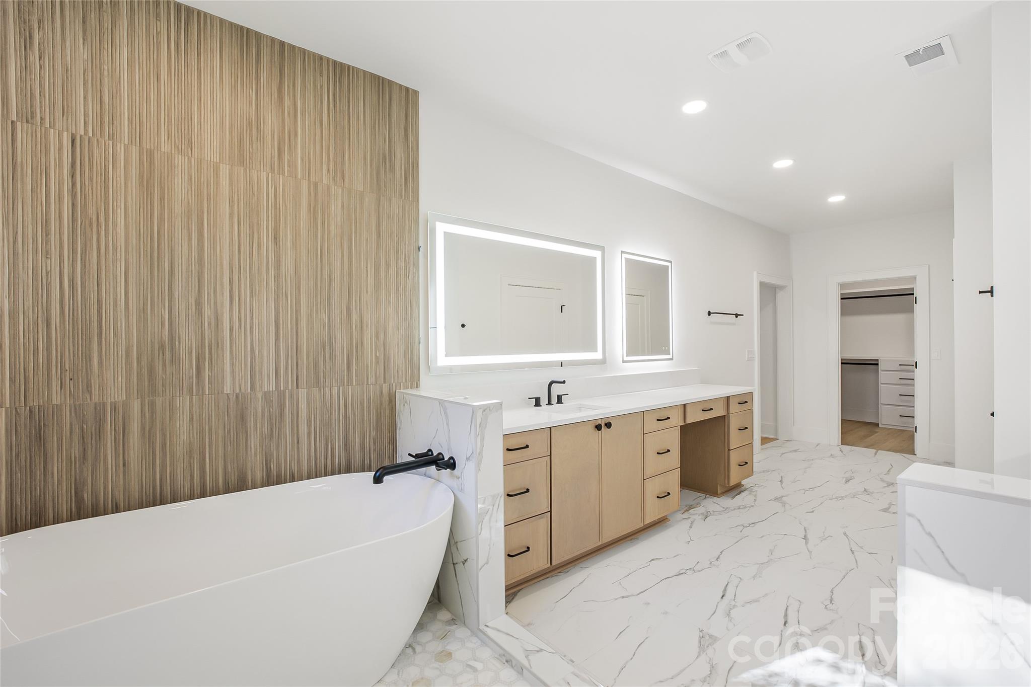 4221 Spring Street Charlotte, NC 28270 - Photo 25 of 44 a bathroom with a bathtub and a sink