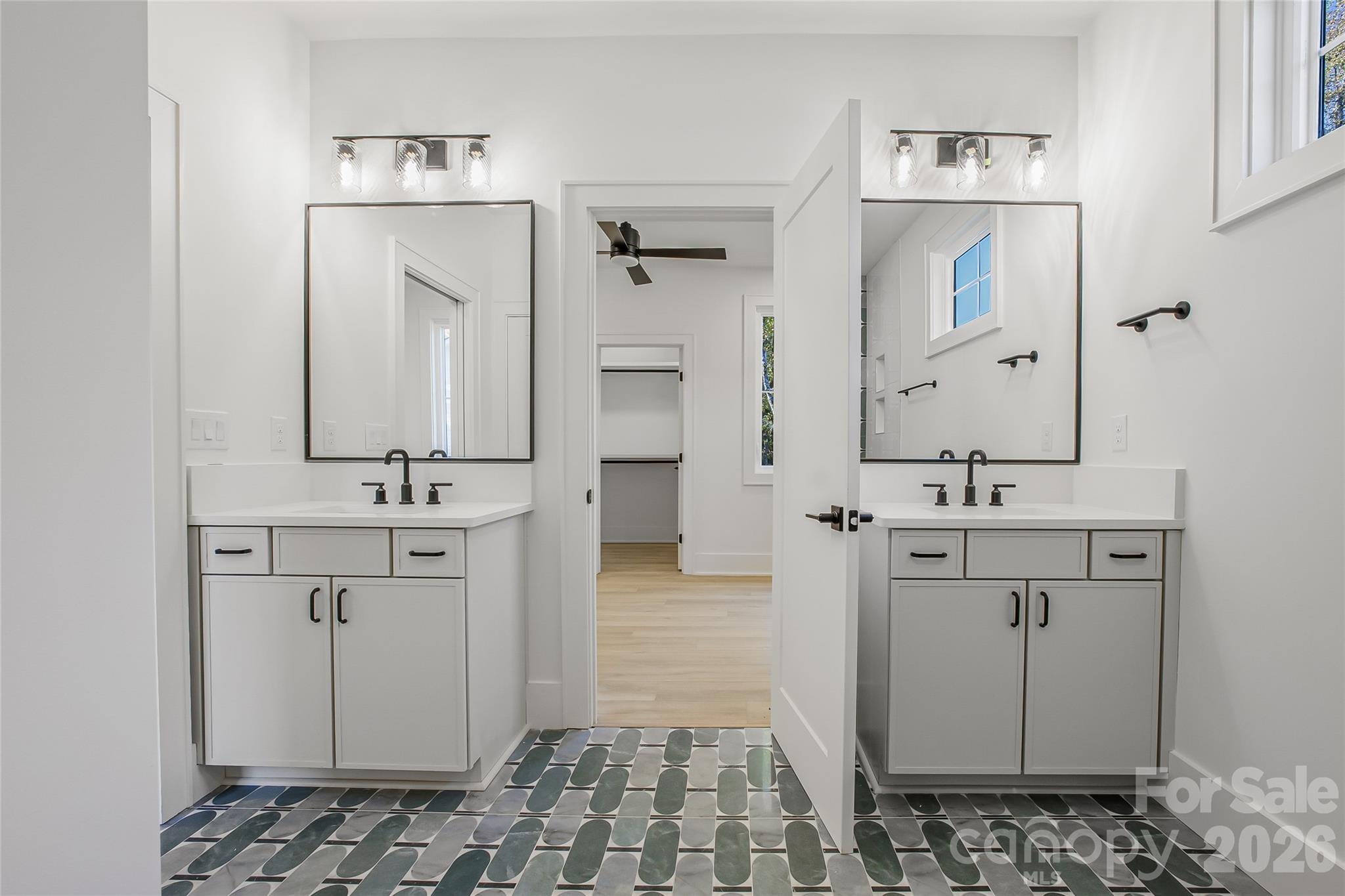 4221 Spring Street Charlotte, NC 28270 - Photo 29 of 44 a bathroom with a sink and a mirror