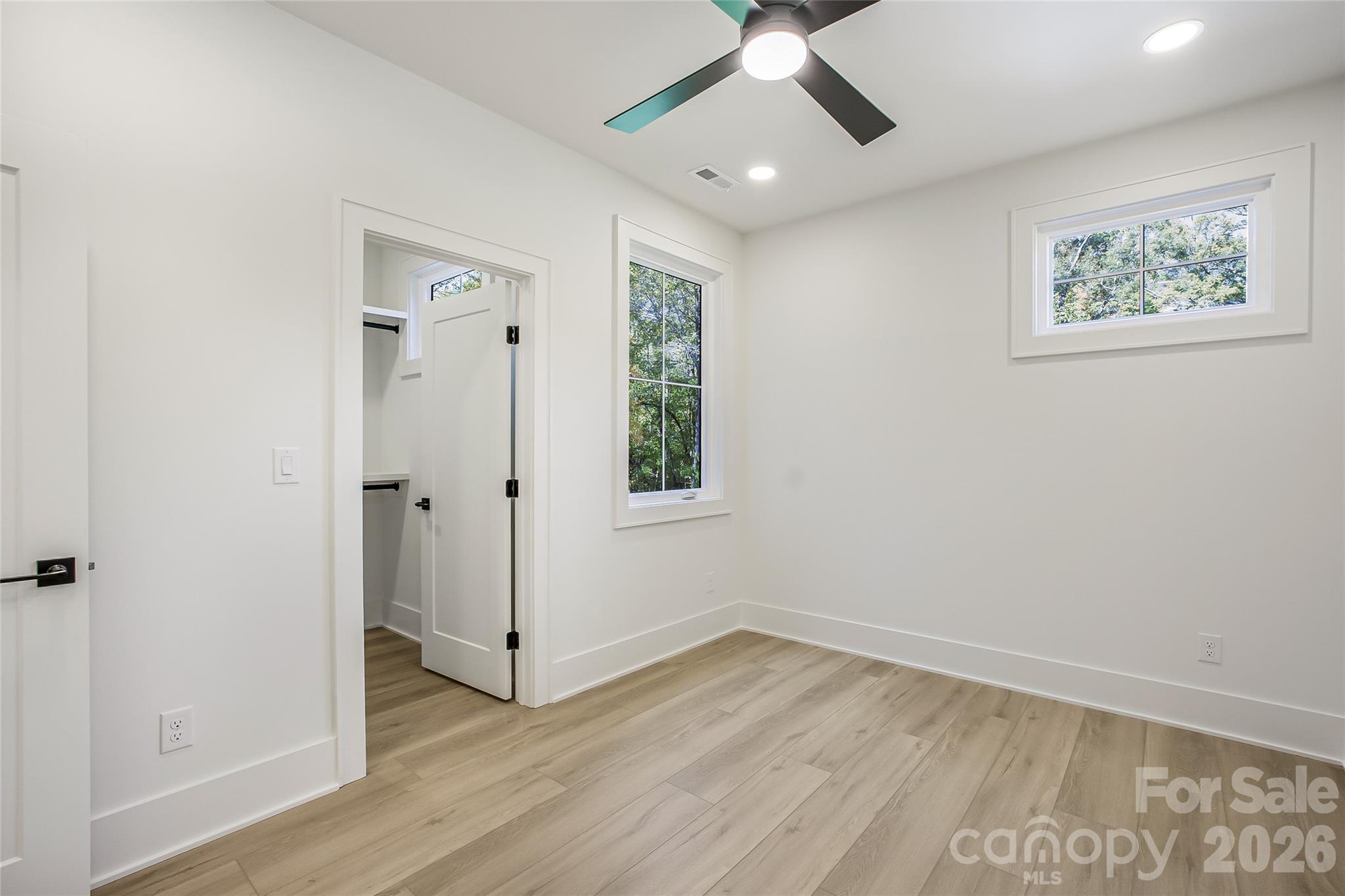 4221 Spring Street Charlotte, NC 28270 - Photo 35 of 44 wooden floor in an empty room with a window