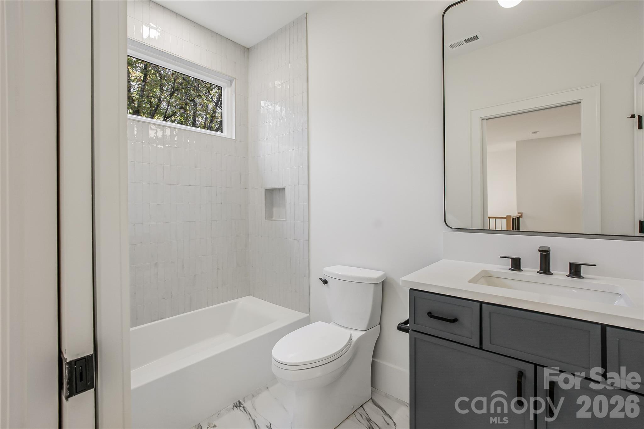 4221 Spring Street Charlotte, NC 28270 - Photo 39 of 44 a bathroom with a sink a toilet and shower