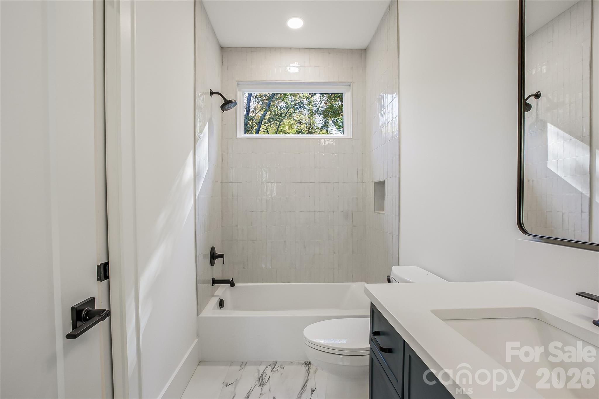 4221 Spring Street Charlotte, NC 28270 - Photo 40 of 44 a bathroom with a granite countertop sink a toilet and shower