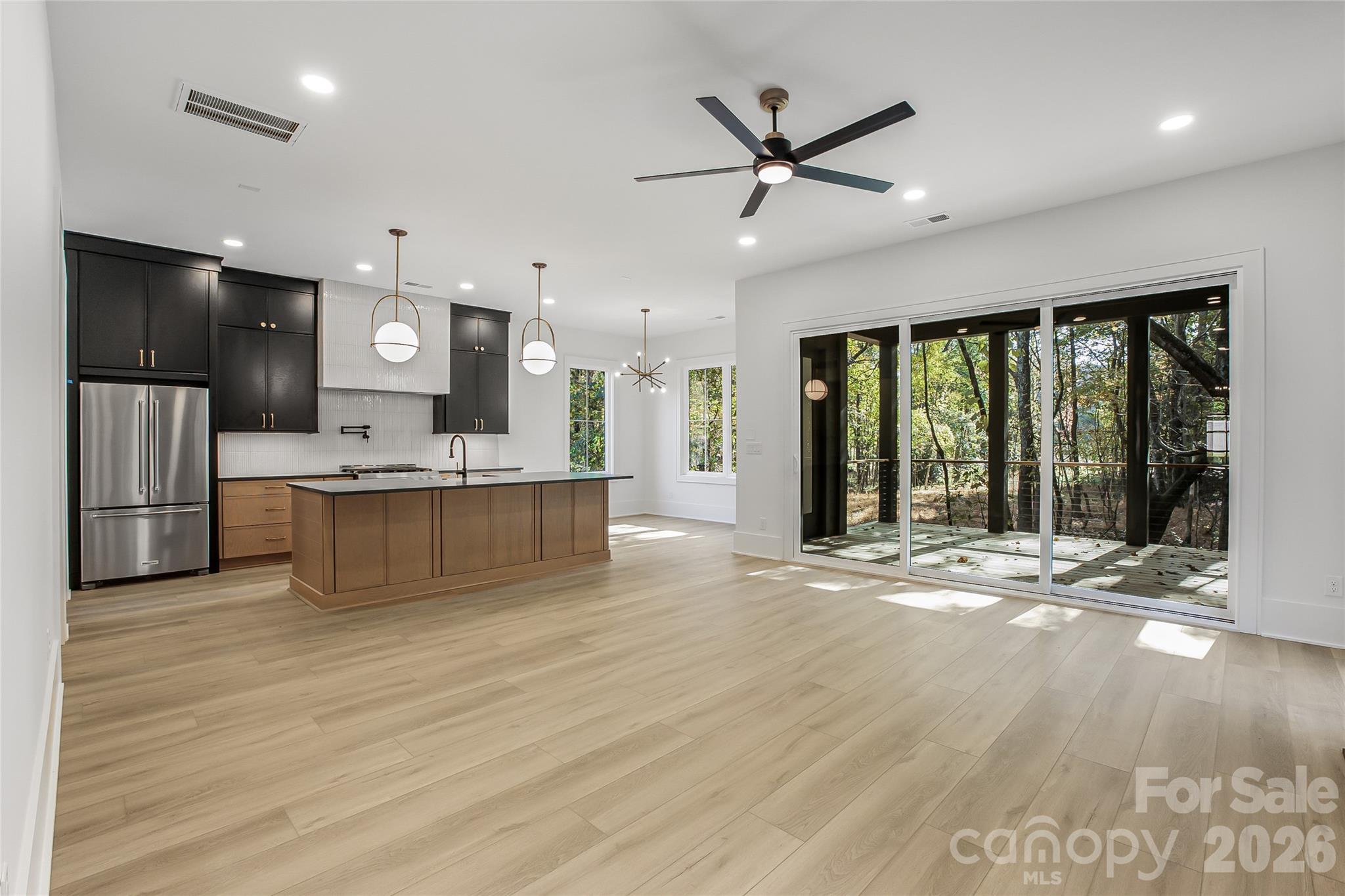 4221 Spring Street Charlotte, NC 28270 - Photo 4 of 44 a view of a kitchen with a sink and a large window