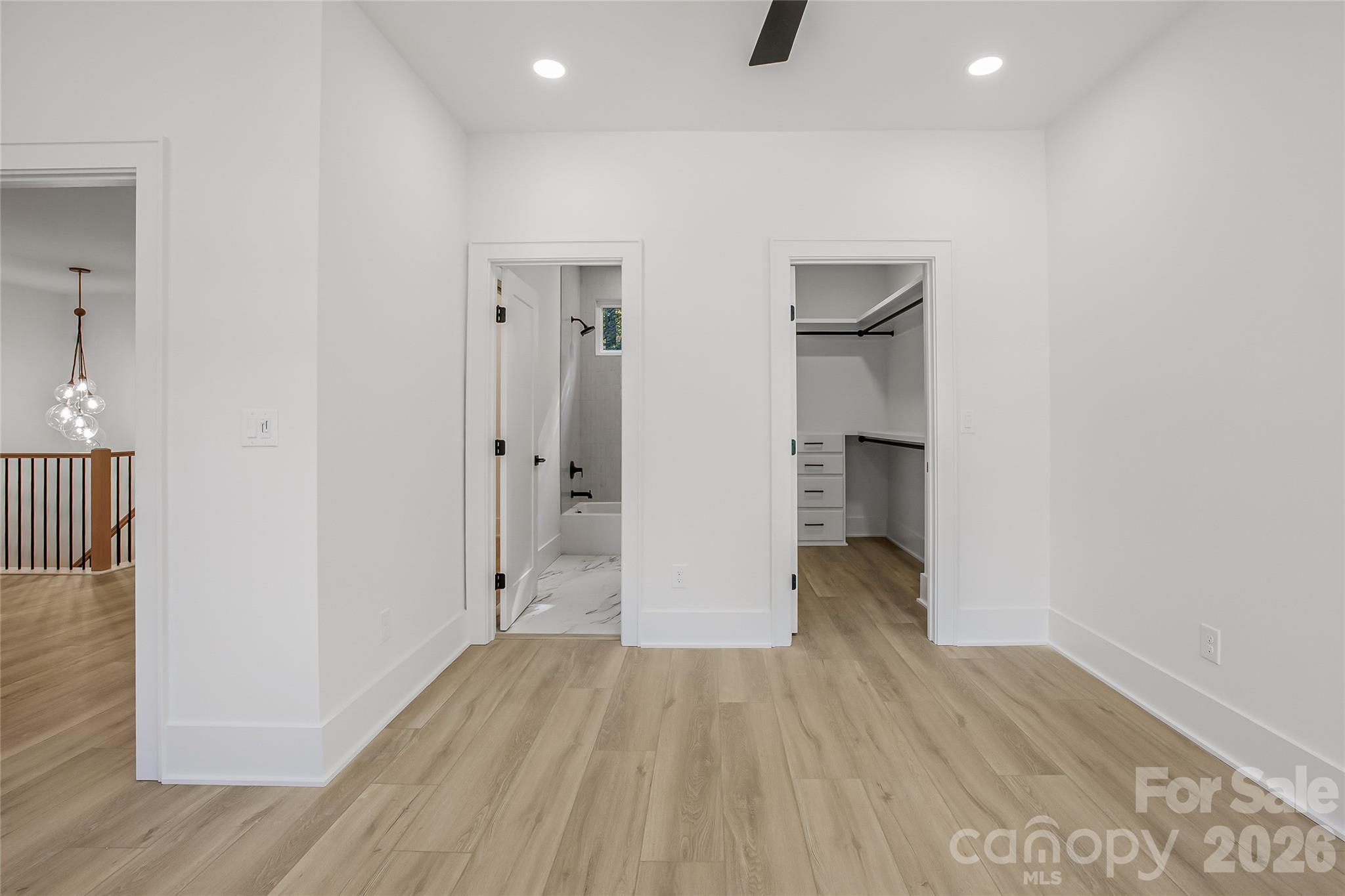 4221 Spring Street Charlotte, NC 28270 - Photo 43 of 44 wooden floor in an empty room with a window