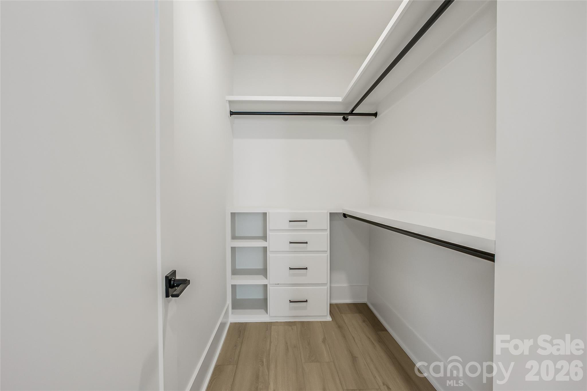 4221 Spring Street Charlotte, NC 28270 - Photo 44 of 44 a view of walk in closet with empty racks