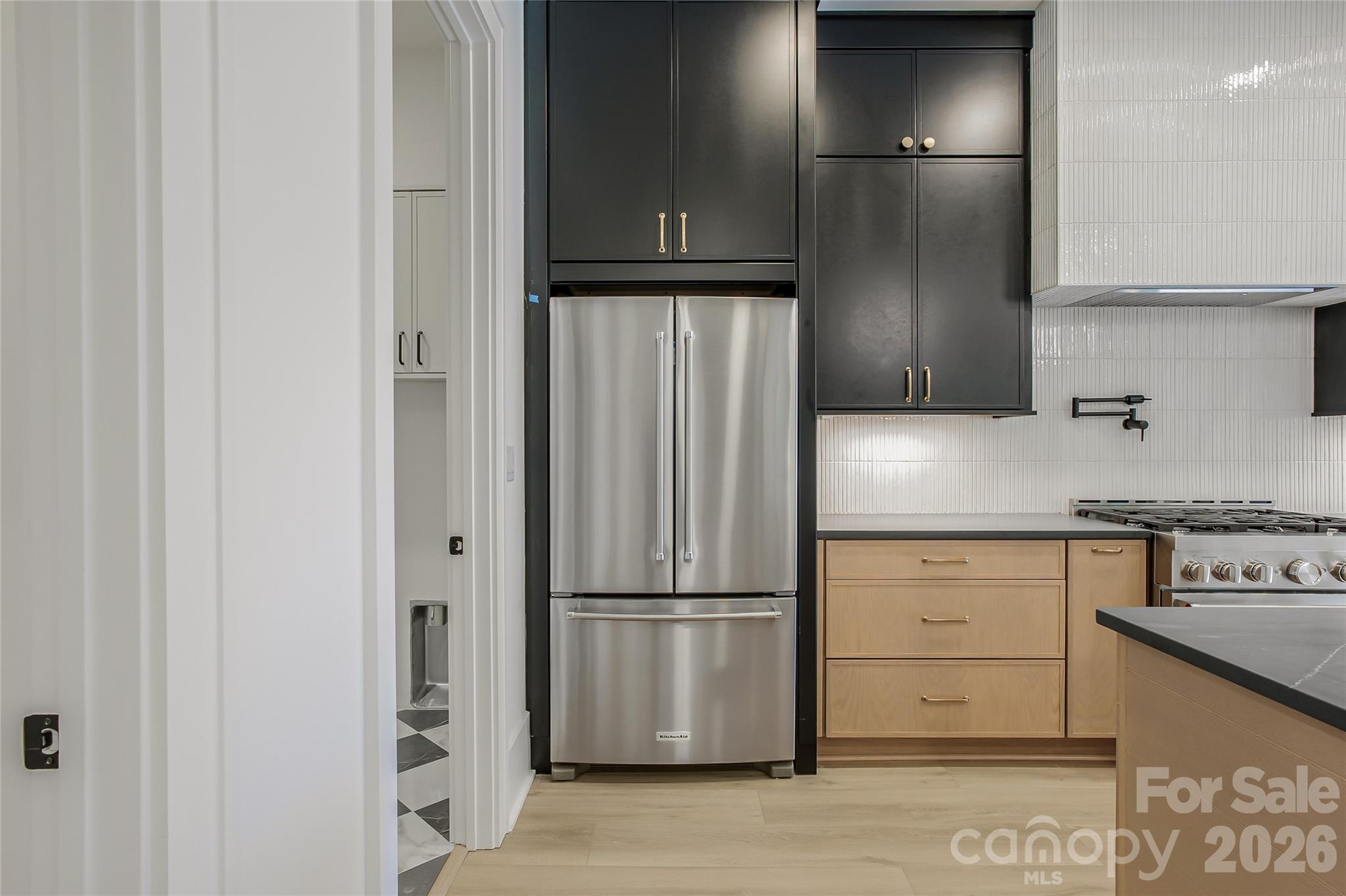 4221 Spring Street Charlotte, NC 28270 - Photo 7 of 44 a kitchen with a refrigerator and a stove