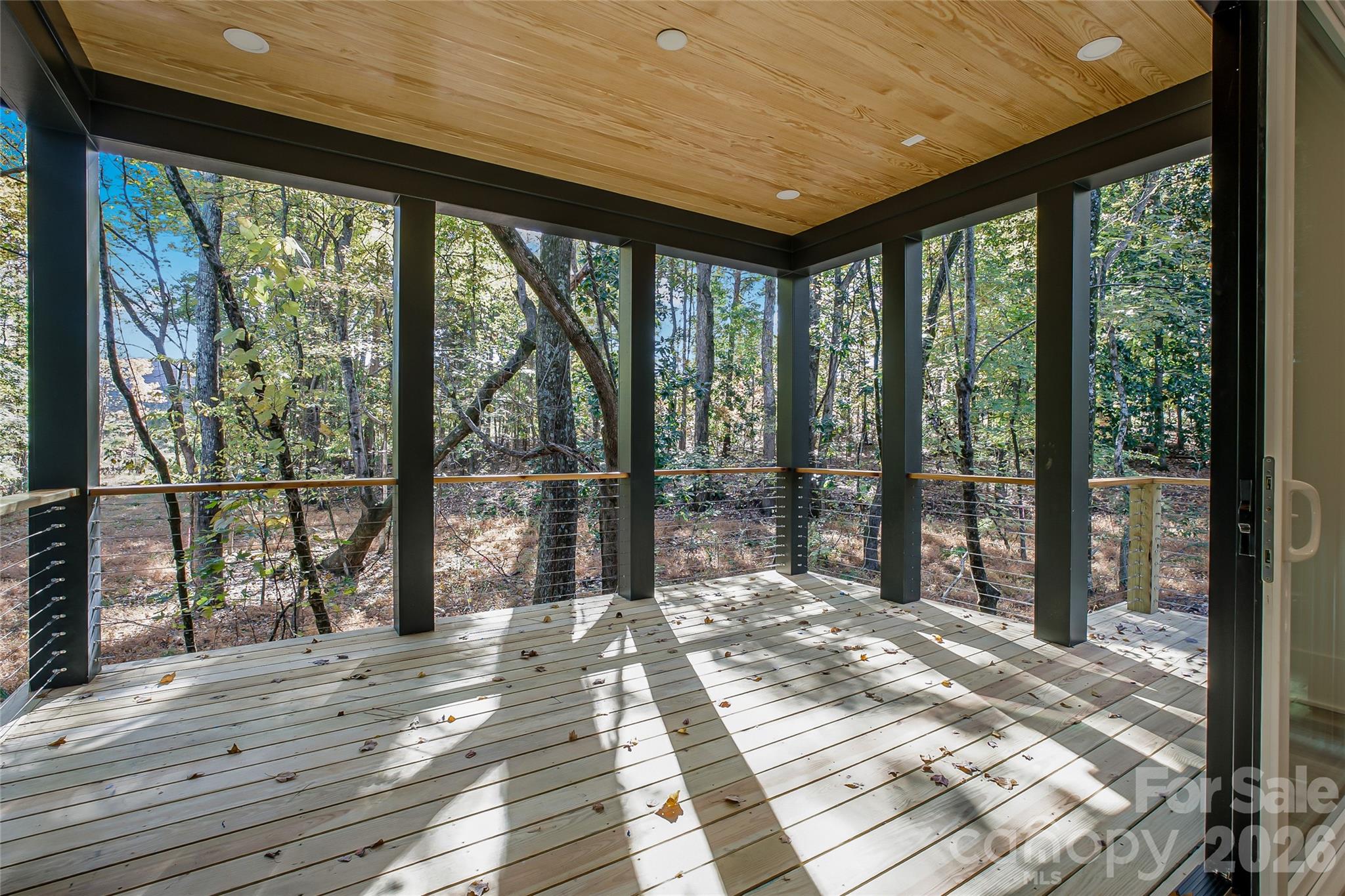 4221 Spring Street Charlotte, NC 28270 - Photo 8 of 44 a bedroom with large windows and a balcony