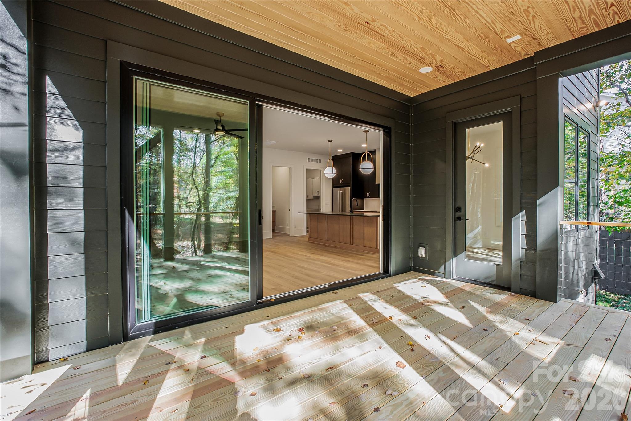 4221 Spring Street Charlotte, NC 28270 - Photo 9 of 44 a bedroom with a bed and glass door