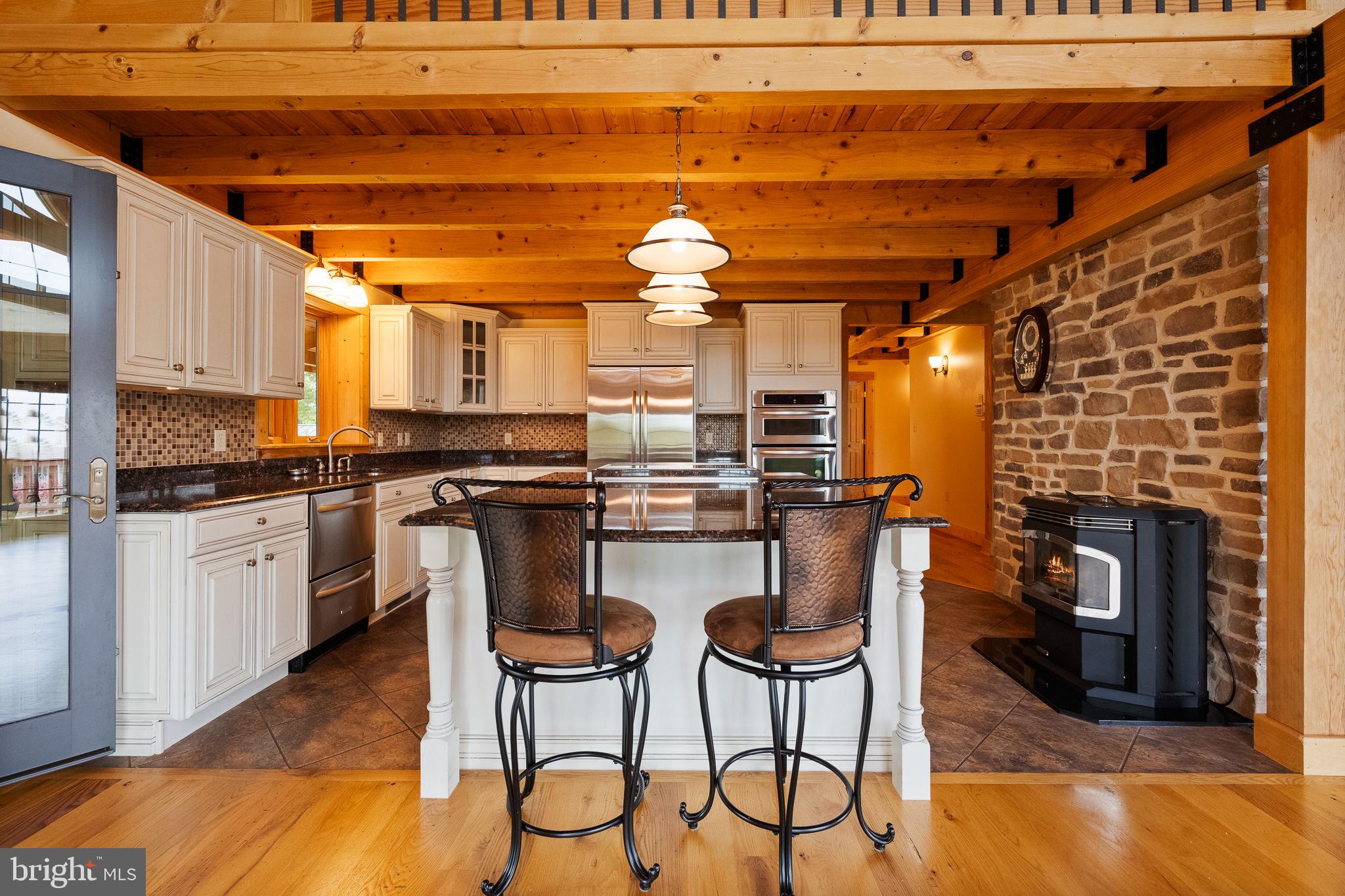 447 Fable Road Hedgesville, WV 25427 - Photo 17 of 81 a kitchen with stainless steel appliances a stove a sink and a refrigerator