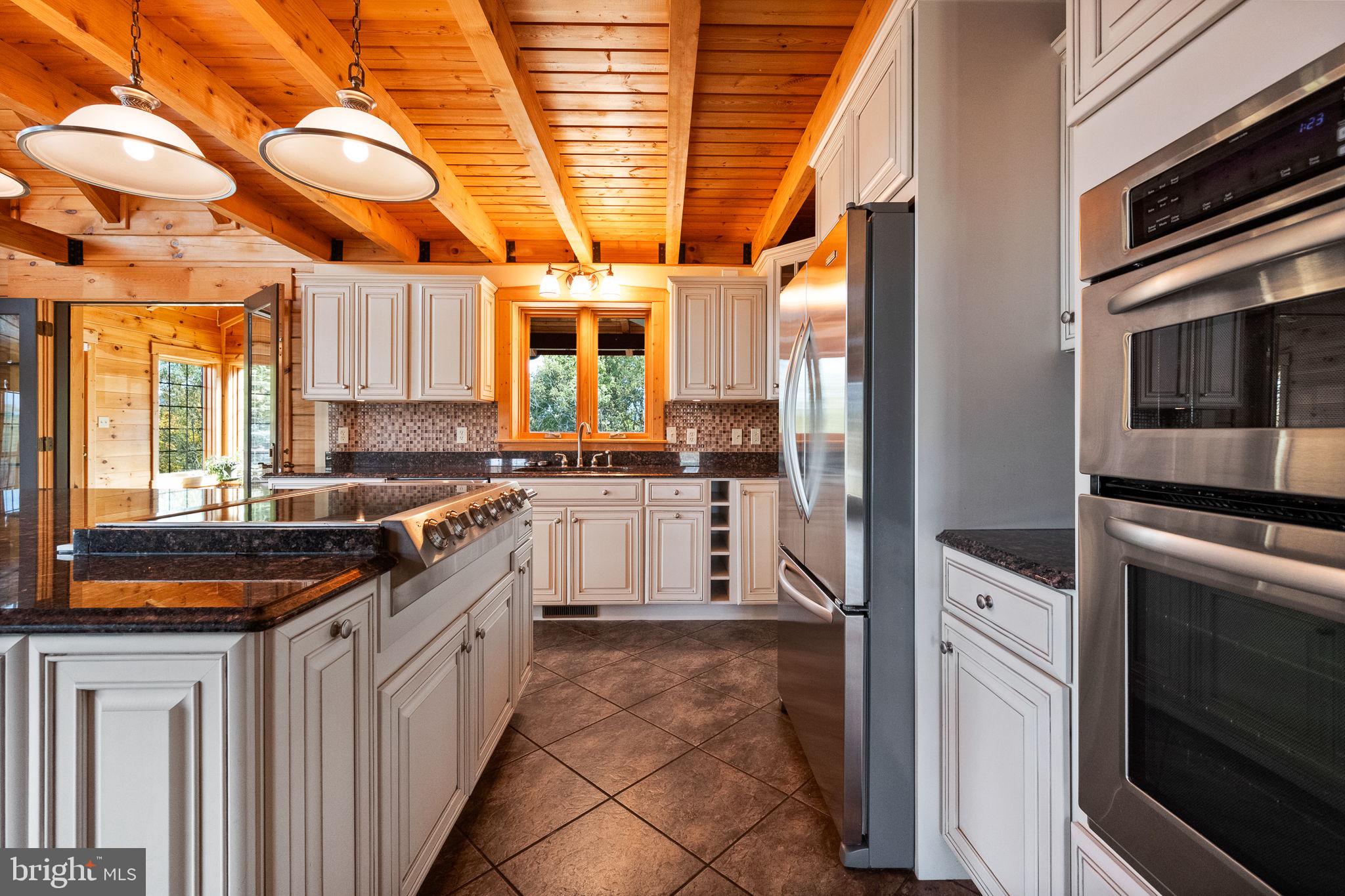 447 Fable Road Hedgesville, WV 25427 - Photo 20 of 81 a kitchen with stainless steel appliances granite countertop a stove and a sink