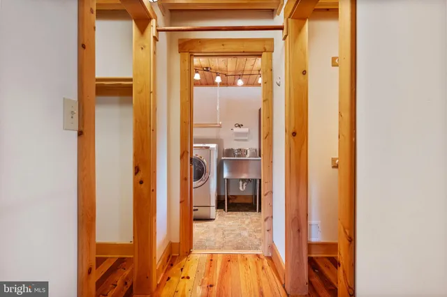 a bathroom with a granite countertop sink and a toilet
