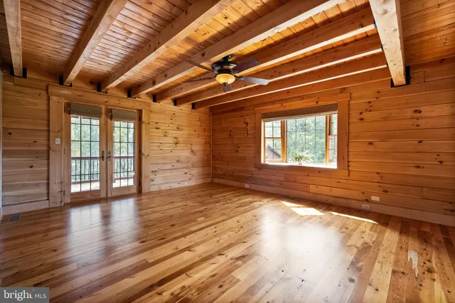 a view of an empty room with a staircase