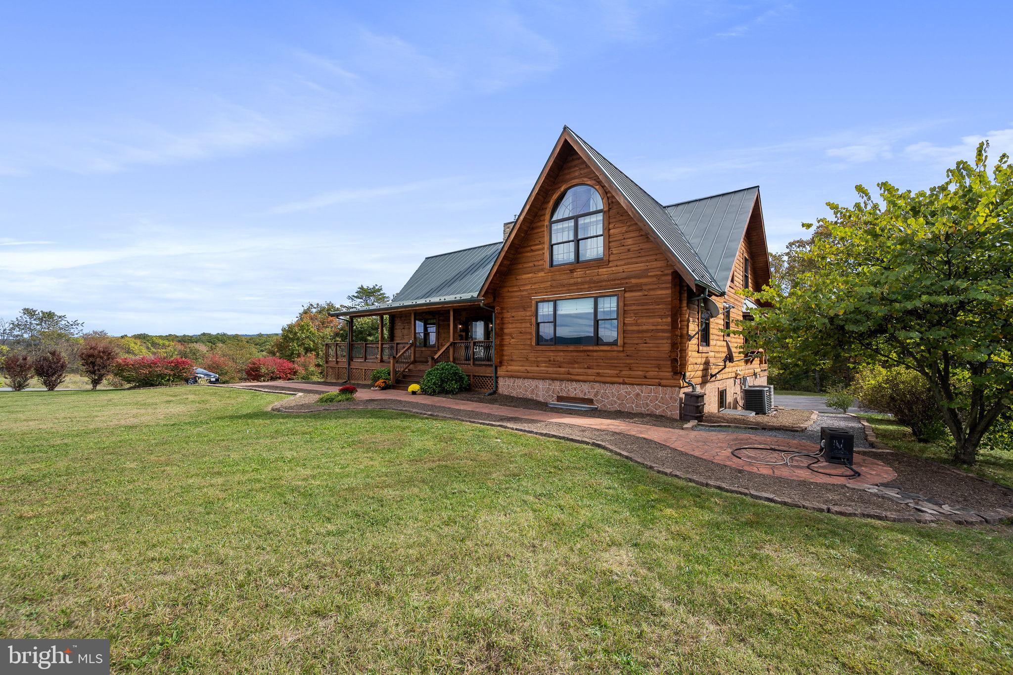 447 Fable Road Hedgesville, WV 25427 - Photo 3 of 81 a front view of a house with garden