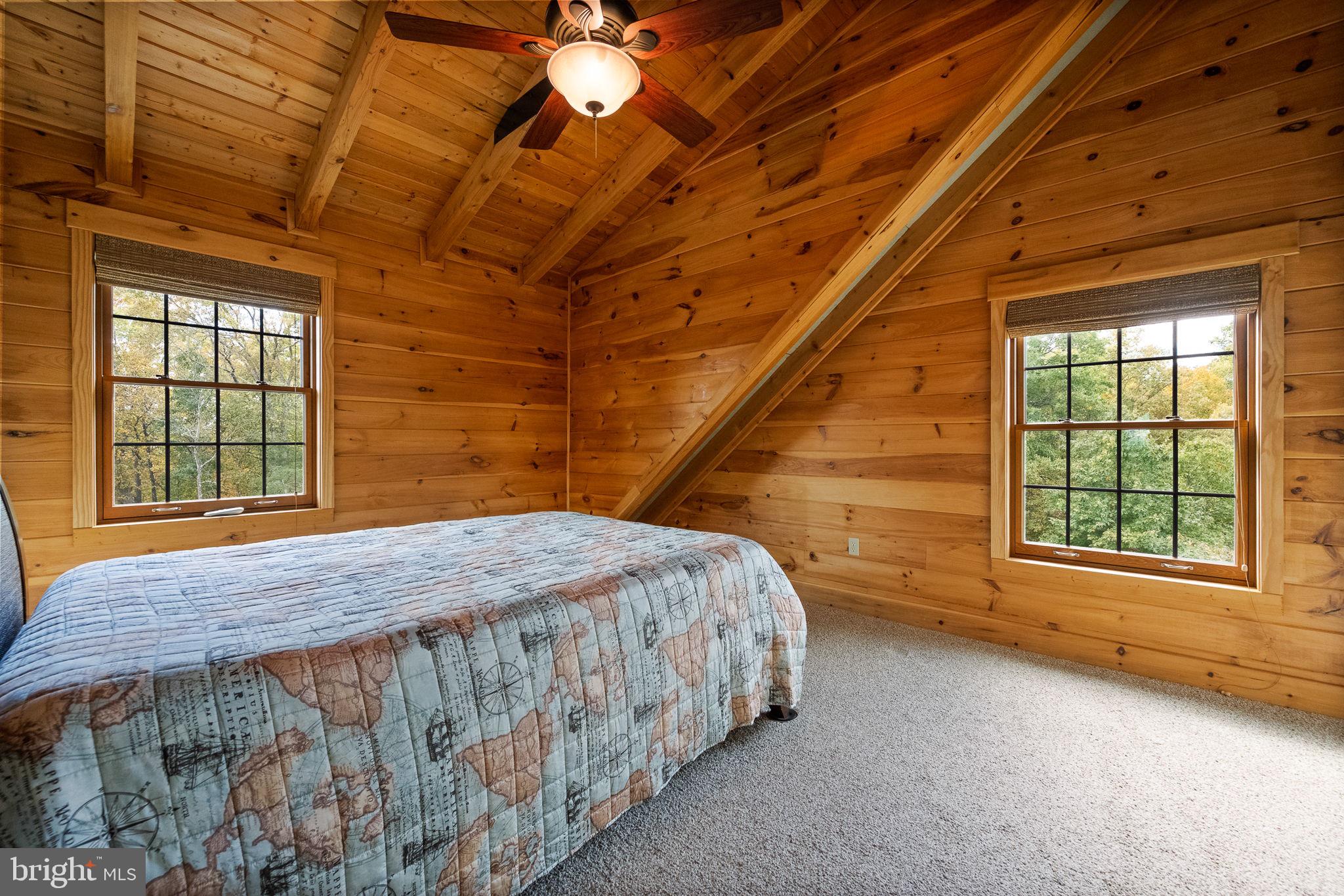 447 Fable Road Hedgesville, WV 25427 - Photo 36 of 81 a bedroom with a bed and a large window