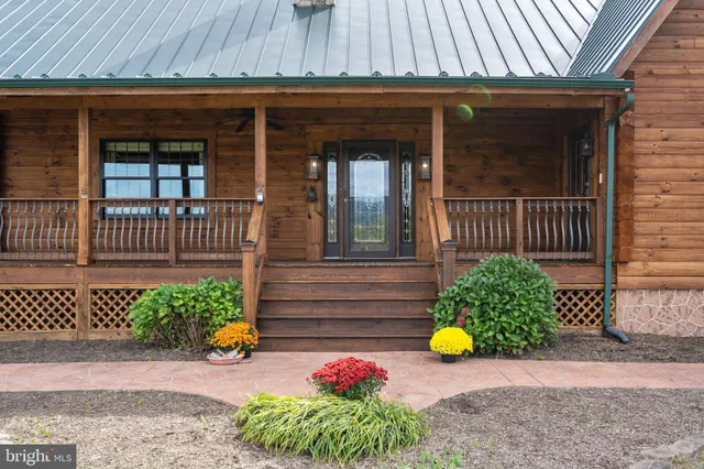 a view of a balcony with wooden floor and fence