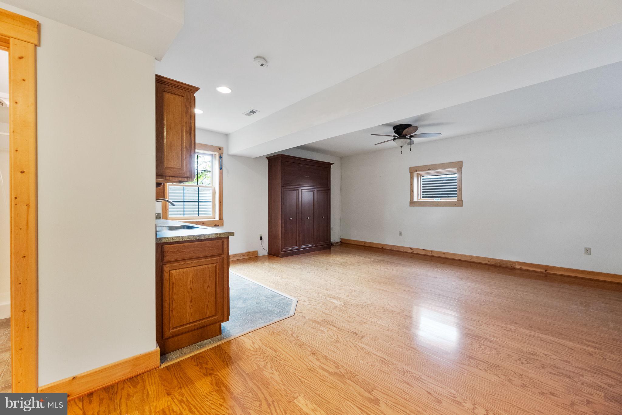 447 Fable Road Hedgesville, WV 25427 - Photo 44 of 81 a view of empty room with wooden floor and fan