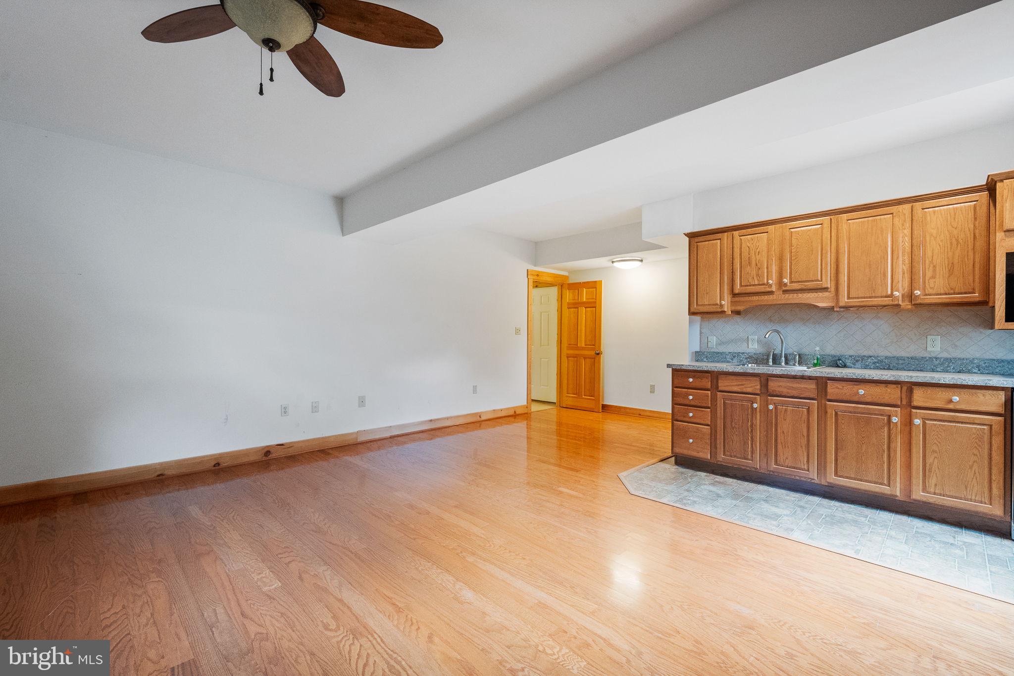 447 Fable Road Hedgesville, WV 25427 - Photo 45 of 81 a view of kitchen with granite countertop cabinets and wooden floor