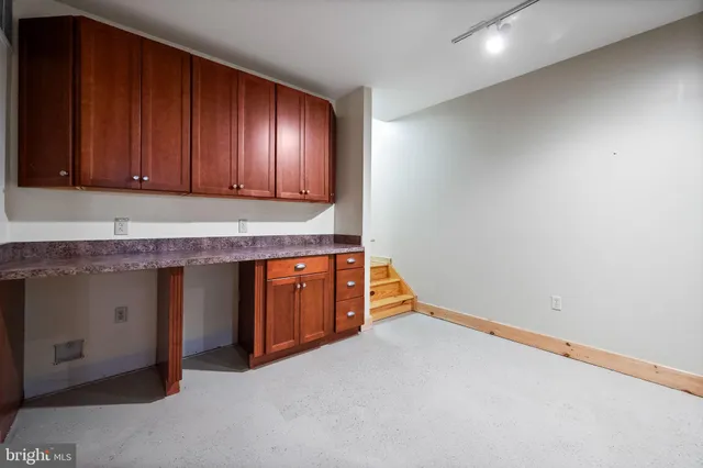 a view of a swimming pool with a yard