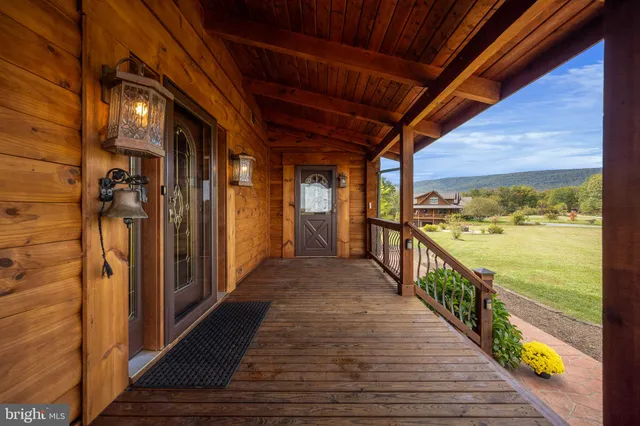 a view of balcony with wooden floor and fence