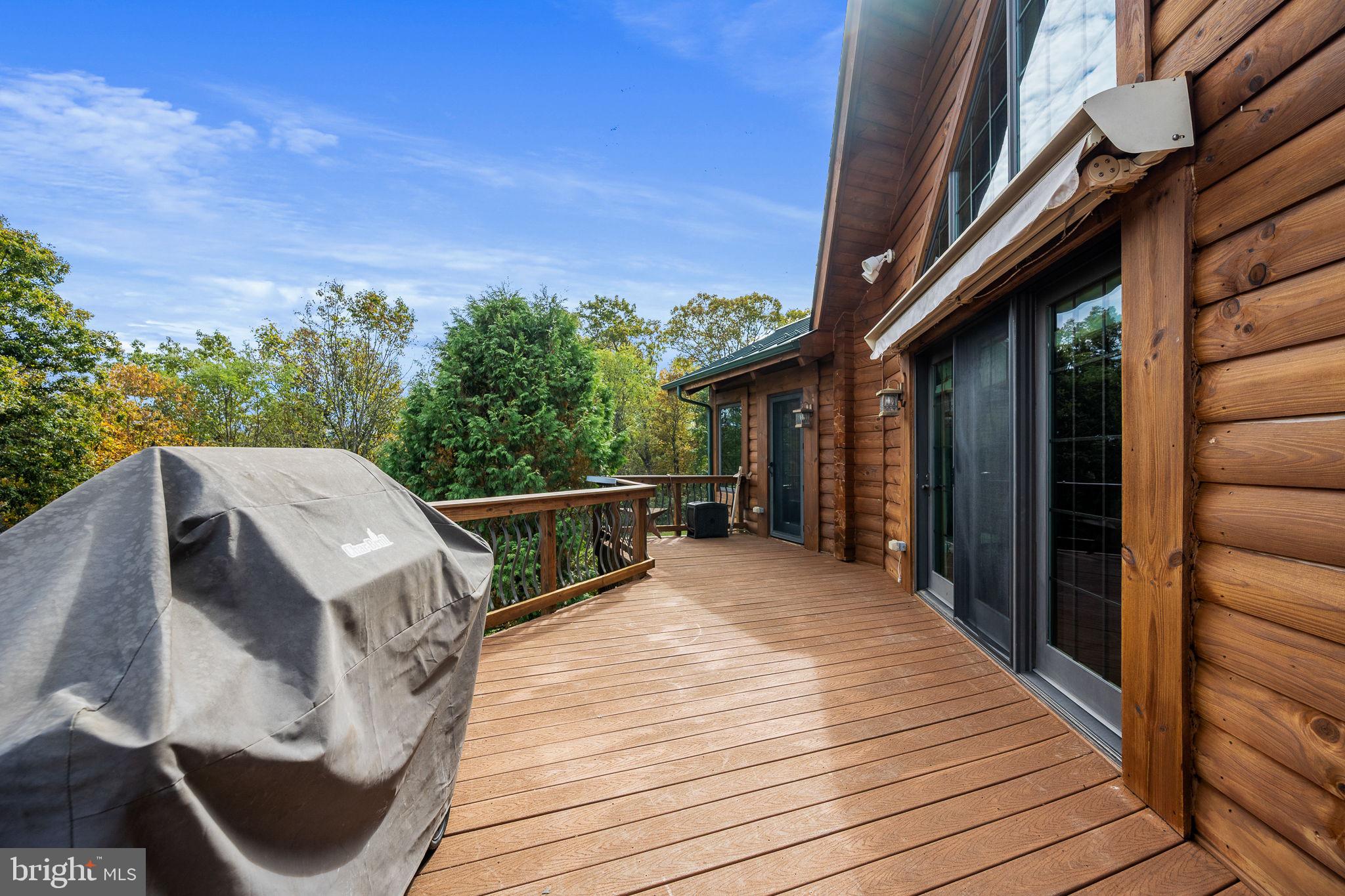447 Fable Road Hedgesville, WV 25427 - Photo 8 of 81 a view of a balcony with wooden floor and iron stairs
