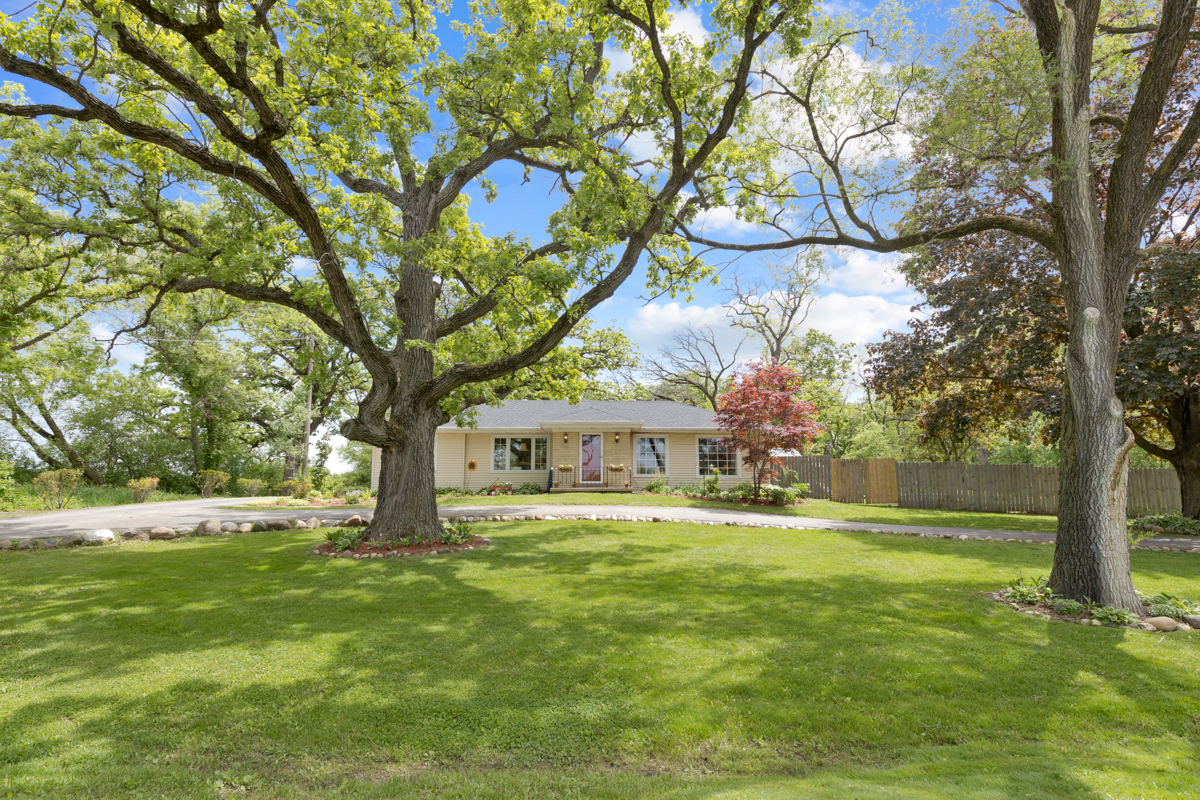 4604 Sunnyside Road Woodstock, IL 60098 - Photo 11 of 37 a view of swimming pool with a garden and trees