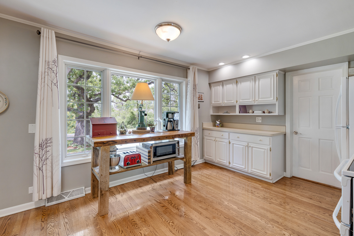 4604 Sunnyside Road Woodstock, IL 60098 - Photo 12 of 37 a kitchen with a stove a sink and a refrigerator