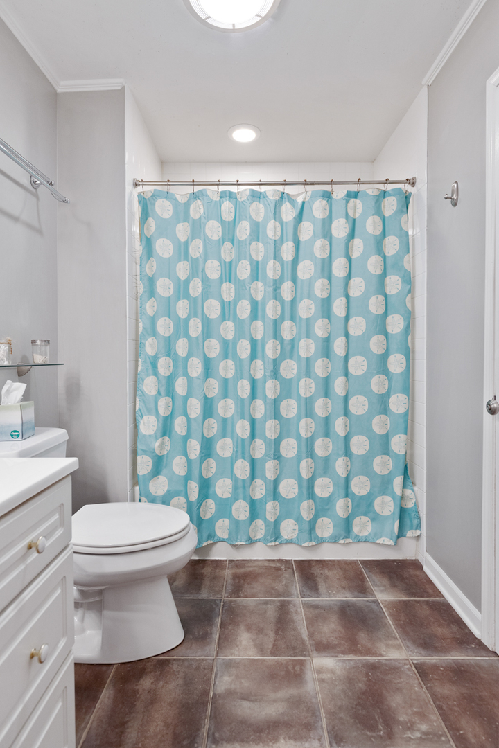 4604 Sunnyside Road Woodstock, IL 60098 - Photo 16 of 37 a bathroom with a toilet and a shower curtain