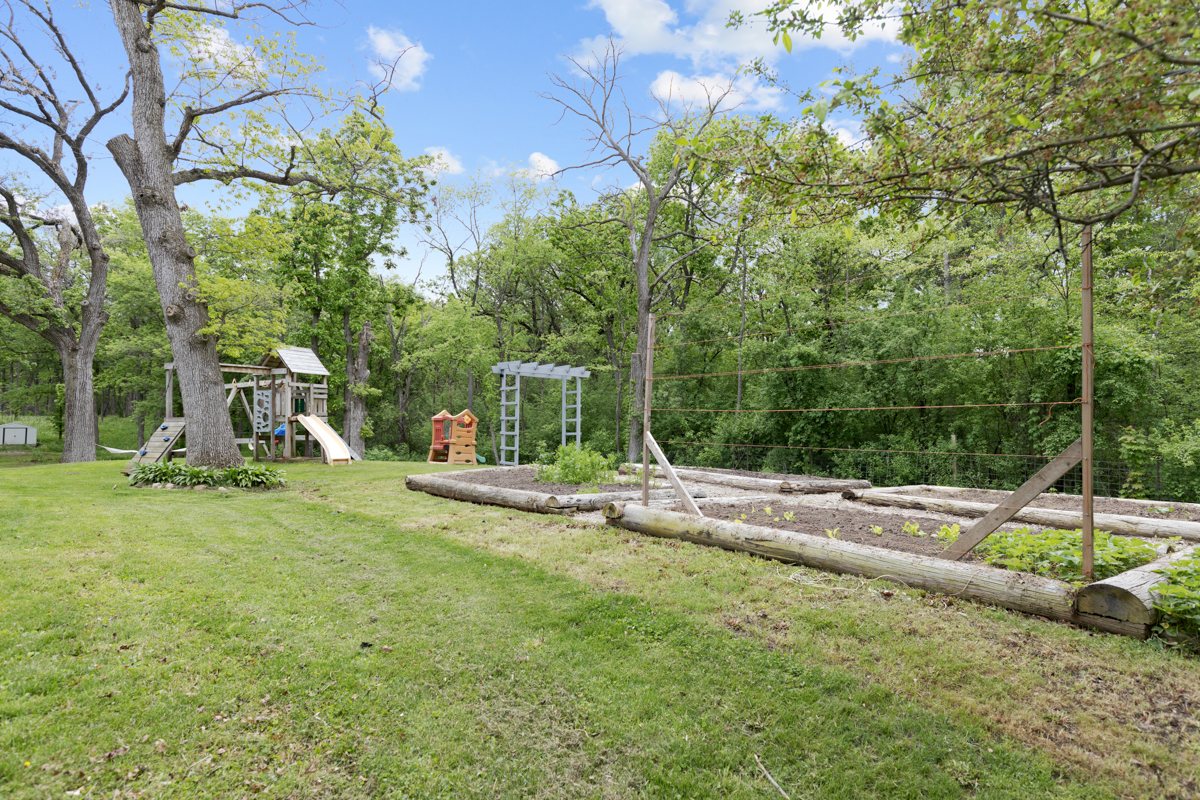 4604 Sunnyside Road Woodstock, IL 60098 - Photo 23 of 37 a view of a park with large trees and a park