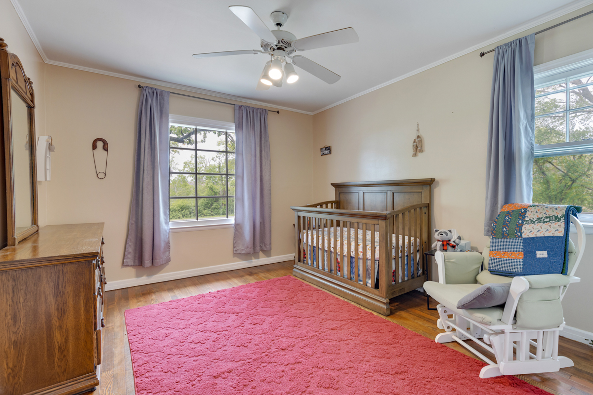 4604 Sunnyside Road Woodstock, IL 60098 - Photo 26 of 37 a bedroom with furniture and a window