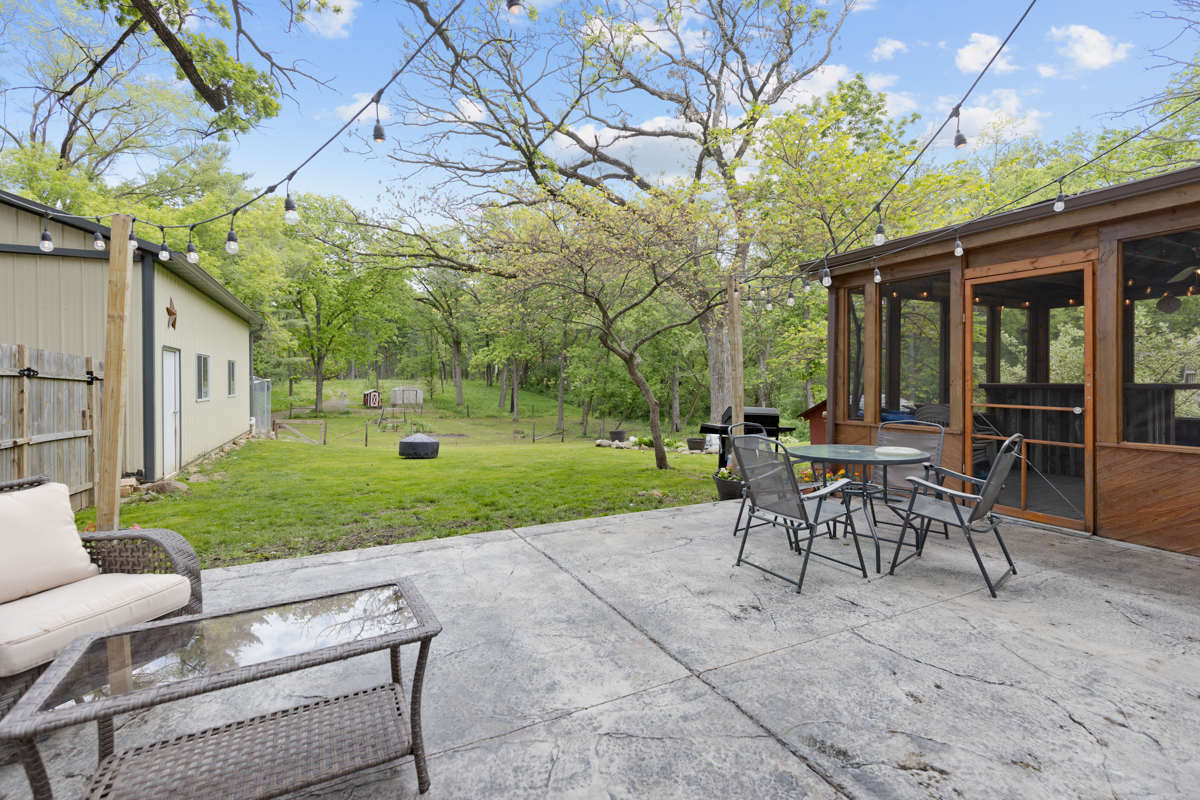 4604 Sunnyside Road Woodstock, IL 60098 - Photo 30 of 37 a view of a house with backyard and a sitting area