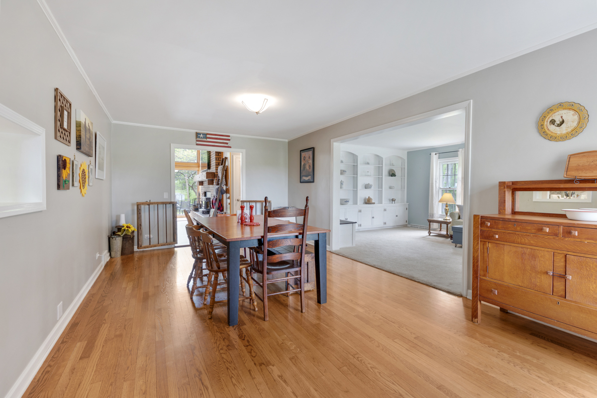 4604 Sunnyside Road Woodstock, IL 60098 - Photo 5 of 37 a view of a dining room with furniture and wooden floor