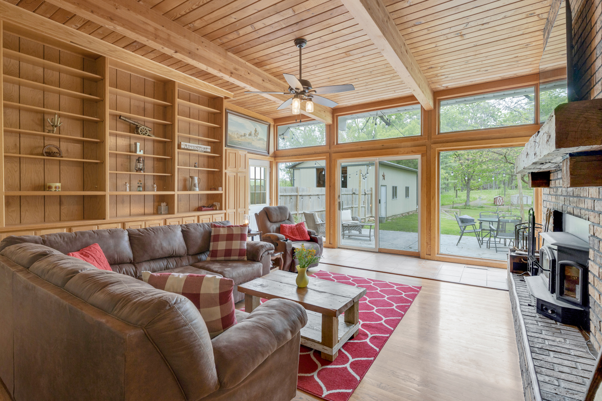4604 Sunnyside Road Woodstock, IL 60098 - Photo 7 of 37 a living room with furniture and a floor to ceiling window