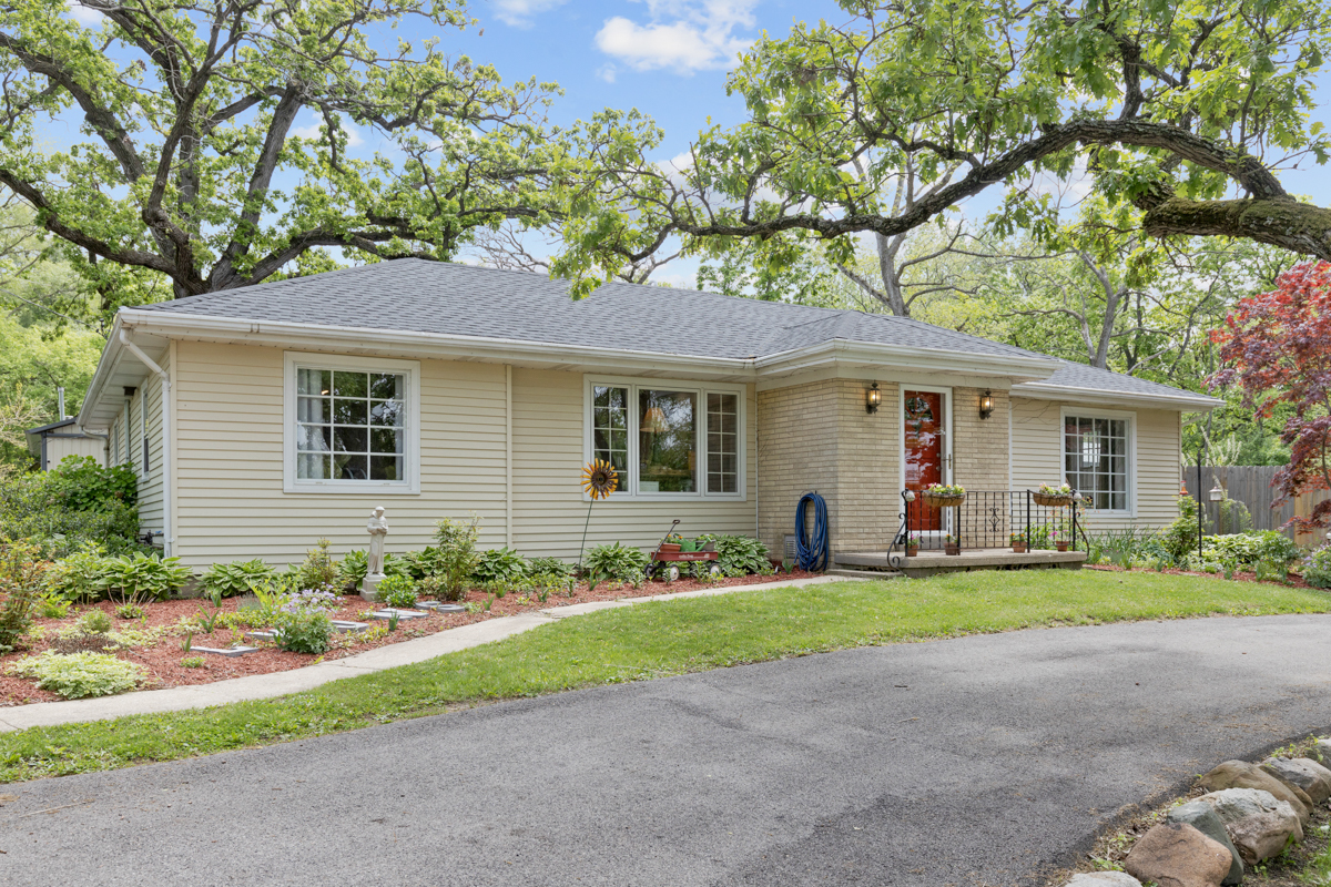 4604 Sunnyside Road Woodstock, IL 60098 - Photo 8 of 37 a front view of a house with a yard and porch