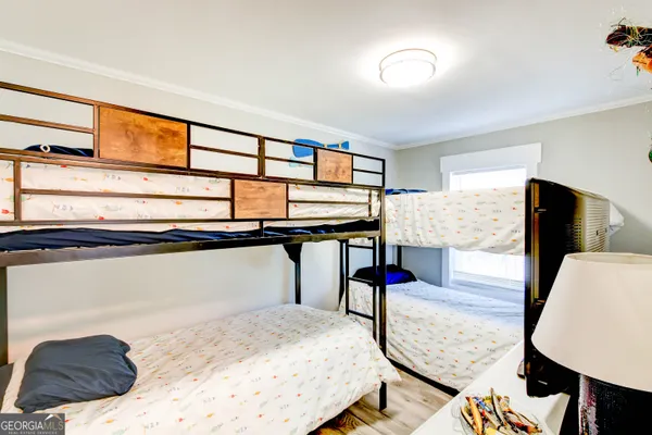 a bedroom with furniture and a window