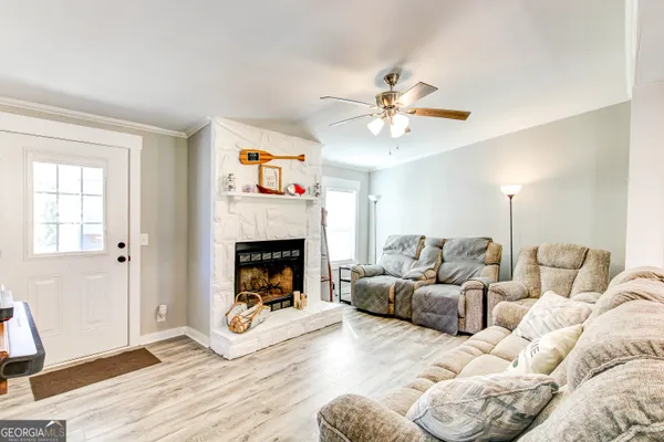 a living room with furniture and a fireplace