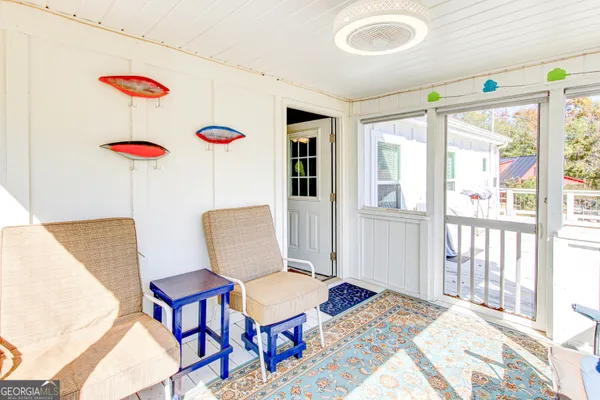 a bed room with a bed and chair