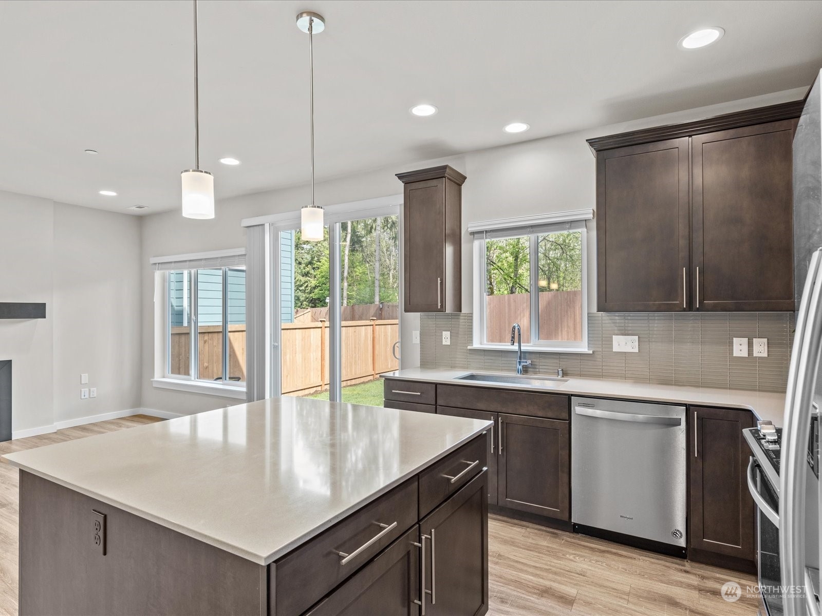 20713 42nd Avenue Southeast, Unit A Bothell, WA 98021 - Photo 15 of 32 a kitchen with stainless steel appliances granite countertop a sink a counter space and a window