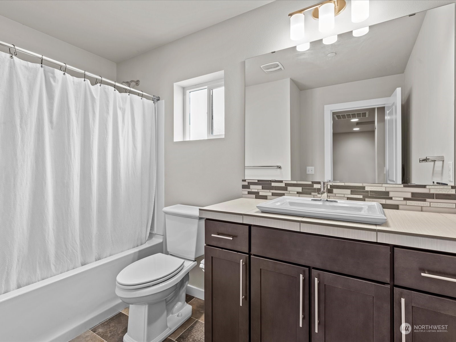 20713 42nd Avenue Southeast, Unit A Bothell, WA 98021 - Photo 25 of 32 a bathroom with a double vanity sink toilet and a mirror