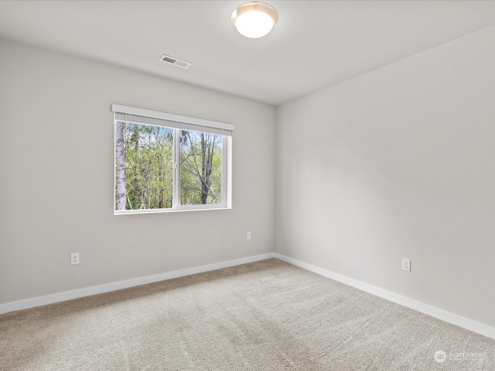 20713 42nd Avenue Southeast, Unit A Bothell, WA 98021 - Photo 26 of 32 an empty room with windows