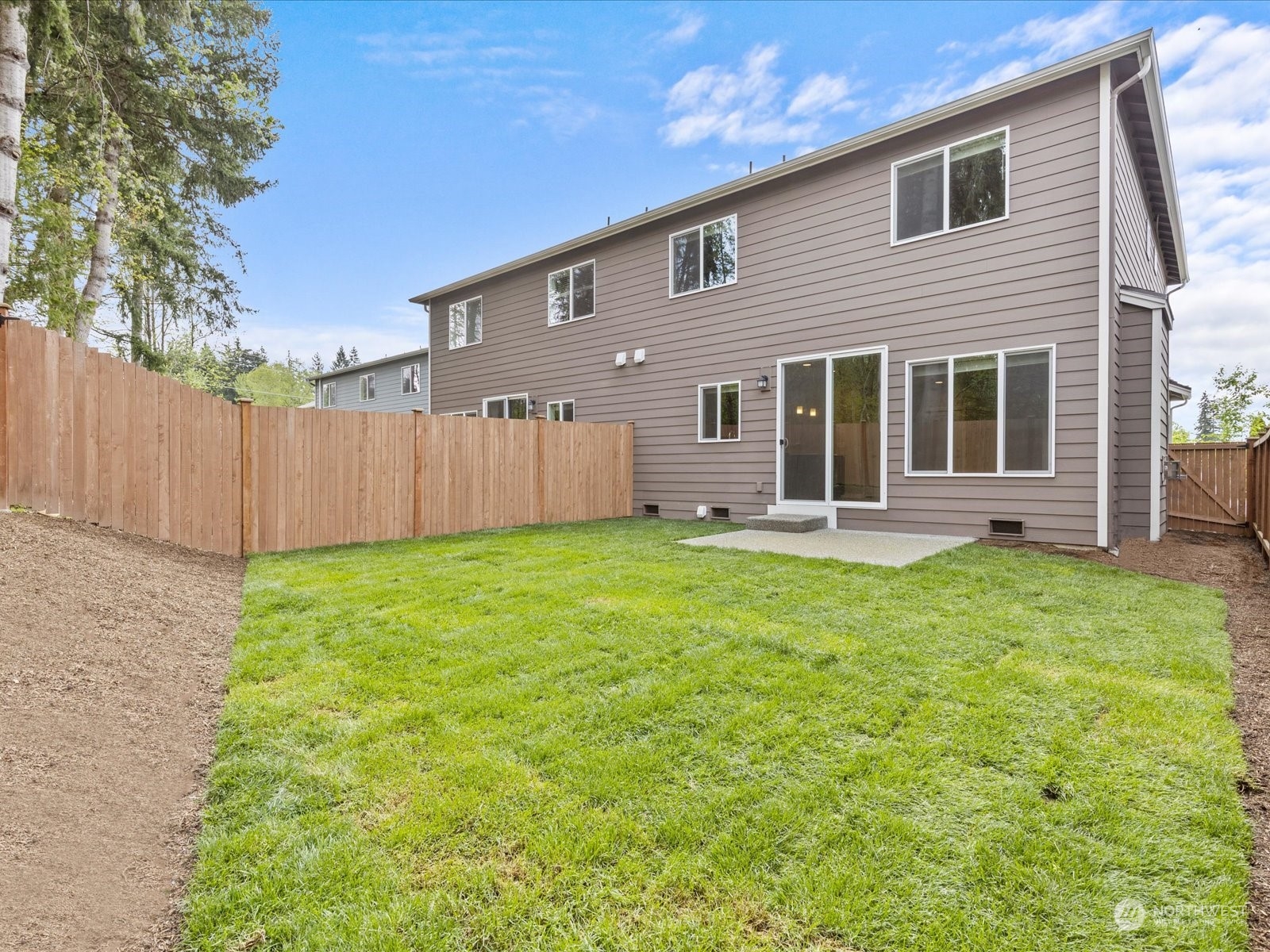 20713 42nd Avenue Southeast, Unit A Bothell, WA 98021 - Photo 30 of 32 a view of a house with backyard and porch