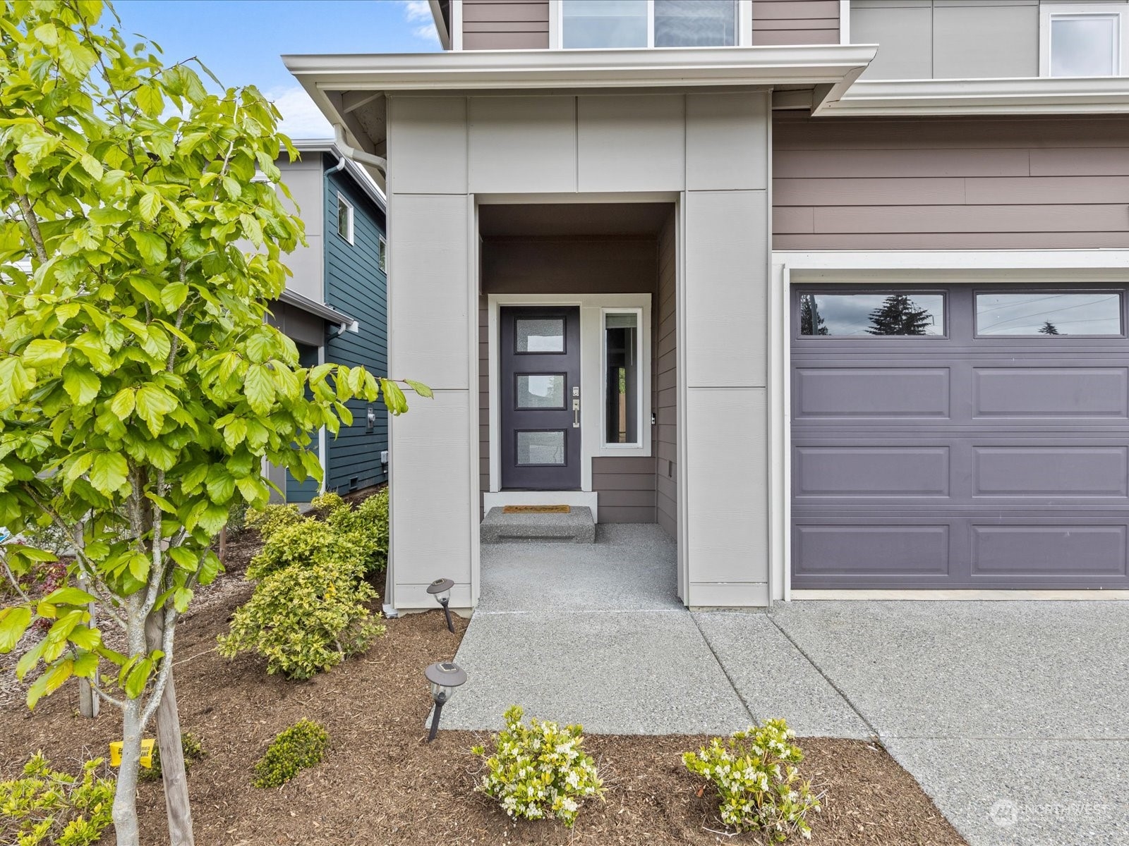 20713 42nd Avenue Southeast, Unit A Bothell, WA 98021 - Photo 32 of 32 a front view of a house with a yard